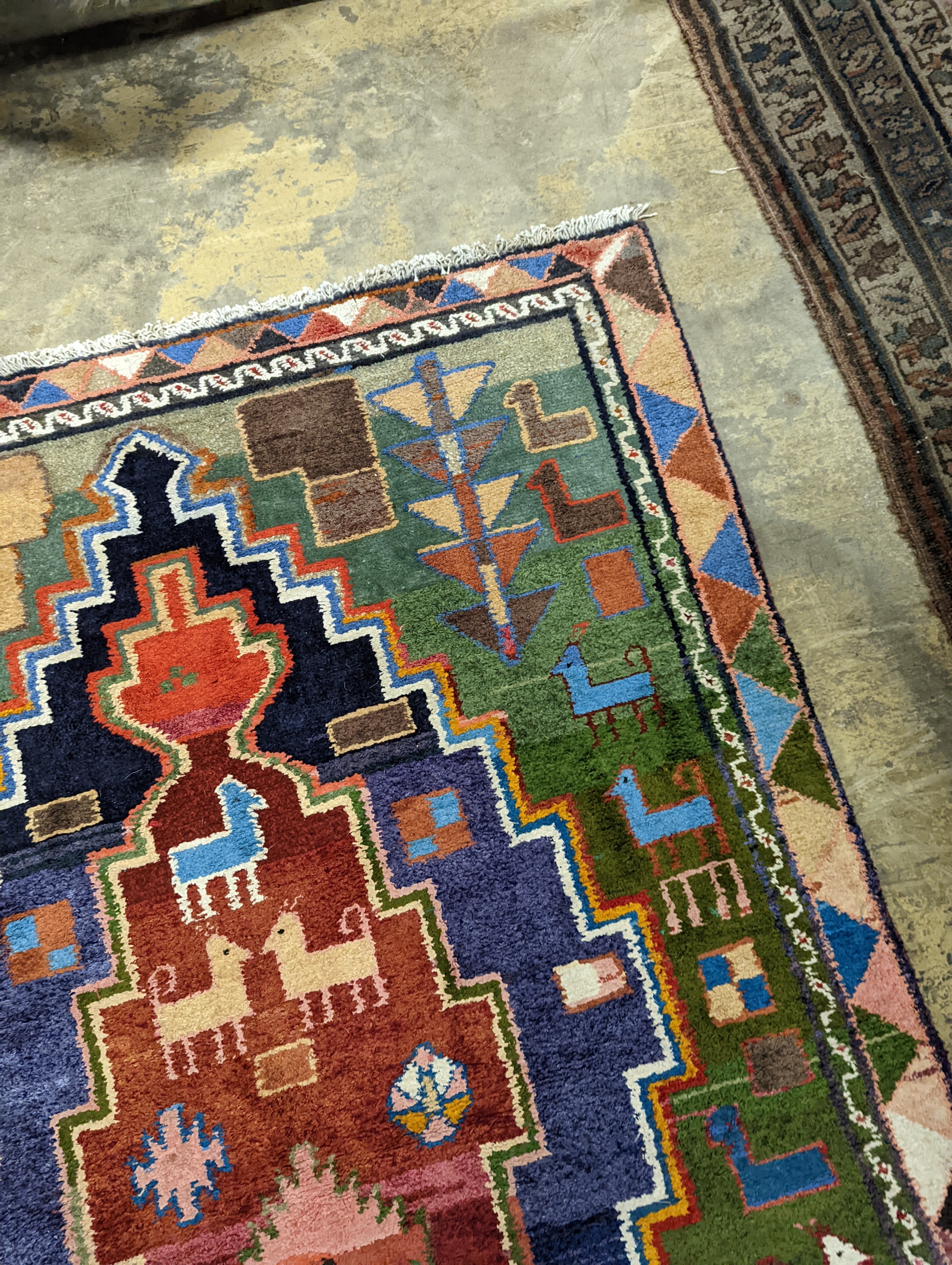 A Caucasian design blue ground rug, 180 x 128cm